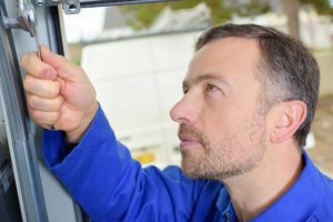 Man installing a garage door